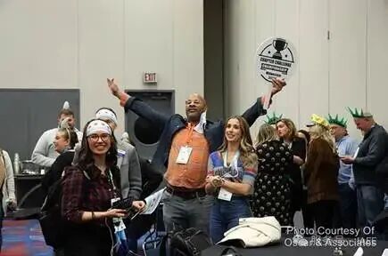 A group of people at an event

AI-generated content may be incorrect.